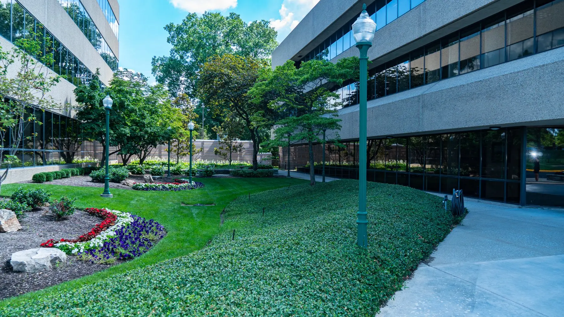 A Southcreek Park office building beside landscaped lawns and gardens